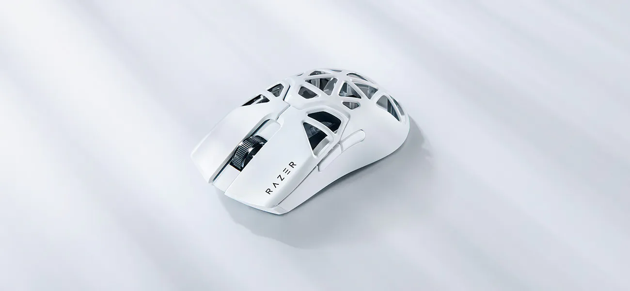 Razer Viper Mini Signature Edition in White, an ultralight gaming mouse with a pristine white magnesium alloy exoskeleton, showcased on a reflective surface.